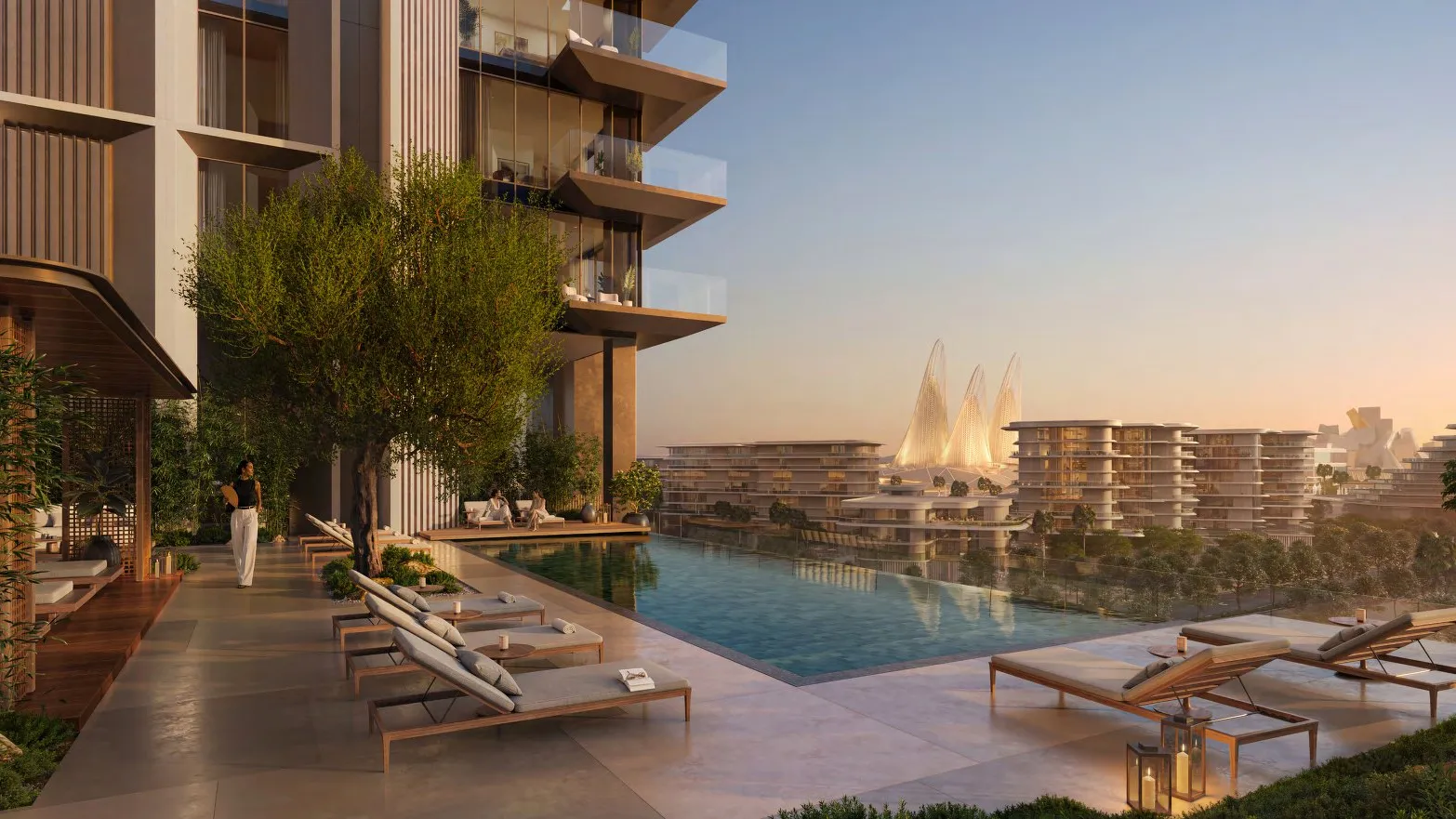 Rooftop infinity pool with loungers, looking out over Saadiyat Cultural District at sunset