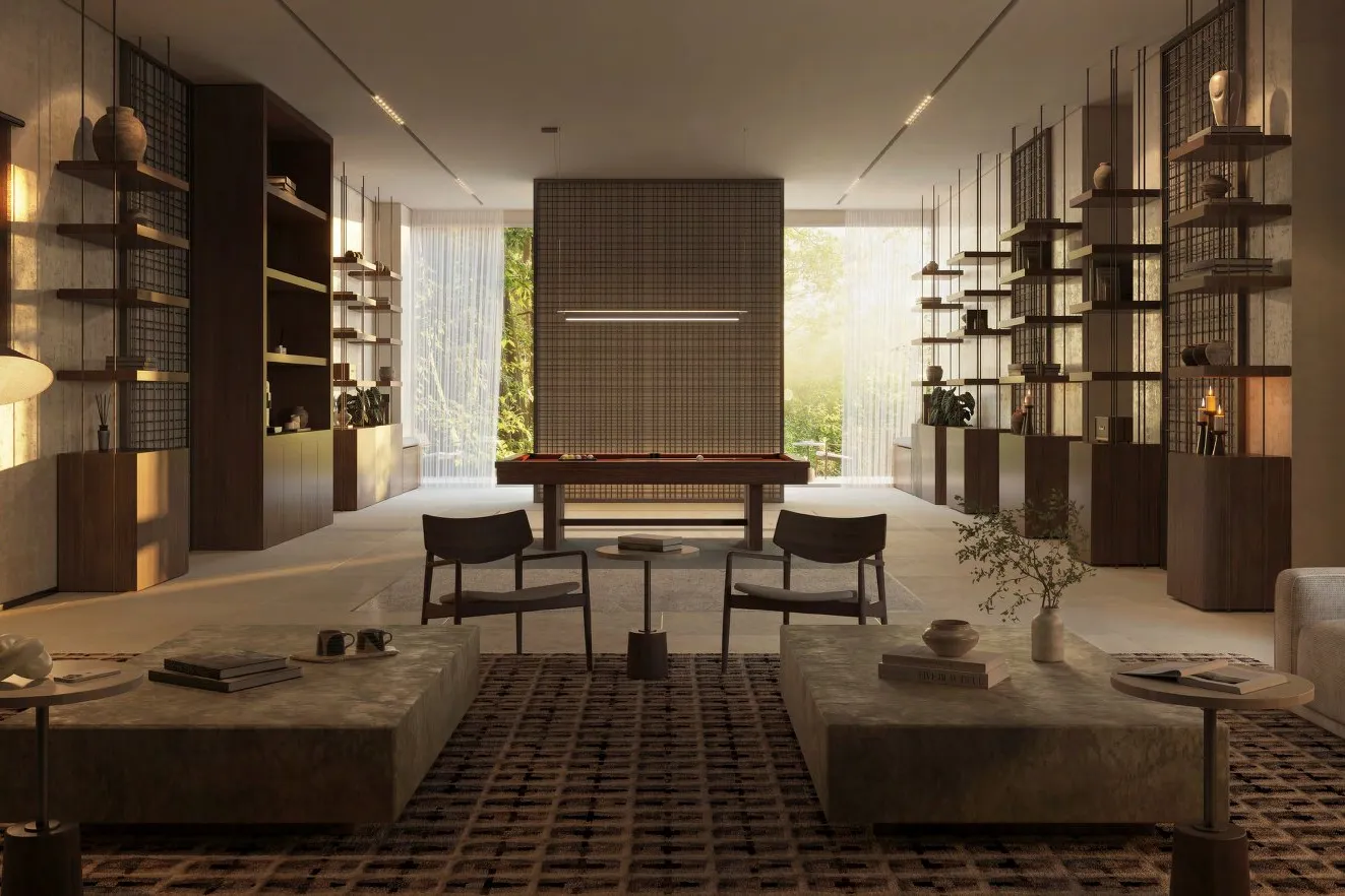 Library and gaming lounge with sofas, bookshelves and a billiard table
